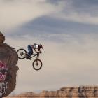Queenstown mountain biker Vinny Armstrong flies off a jump during the women's finals at the Red...
