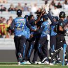 Sri Lanka celebrate after taking the wicket of Rachin Ravindra on Saturday. Photo: Getty Images 

