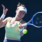 Lulu Sun plays a backhand against Danka Kovinic during their first round match in Melbourne...