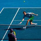 Daniil Medvedev plays a forehand against Kasidit Samrej during their match at the Australian Open...