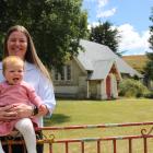 Tokarahi local Tara Hutton at St Peter’s Church with her 11-month-old daughter, Ava. PHOTO: JULES...