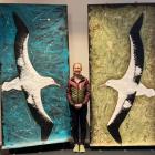 Chrissy Wickes with an artwork depicting the real-size southern royal albatross. PHOTOS: SUPPLIED