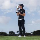 Kiwi Josh Geary kisses the 2025 Victorian Open trophy to celebrate his win on Sunday. PHOTO: PGA...