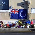 Flowers where Enere McLaren-Taana was fatally stabbed at the Dunedin Bus Hub in Great King St....