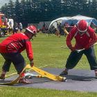 Balclutha firefighter athletes Taine Michie (left) and Nathan Davey rush to sink the standpipe to...