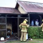 Fire and Emergency New Zealand fire investigators work to determine the cause of a large blaze...