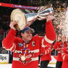 Sidney Crosby of Team Canada celebrates with teammates after defeating Team US in overtime. Photo...