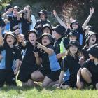 Andersons Bay School pupils watch the RNZAF Hercules C-130H fleet fly over Dunedin yesterday...