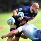Highlanders co-captain Hugh Renton blasts into a team-mate at a training session. PHOTO: PETER...