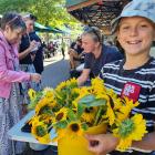 Wānaka high performance junior skier Hugo Guisolan, 12, was selling flowers on Ardmore St on...