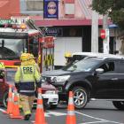 Emergency personnel work at the scene of a crash in South Rd on Tuesday. One firefighter was...