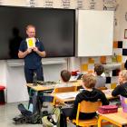John Barker teaches children in a Czech Republic school the English names for shapes. Photo:...