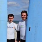Set for a surf at Brighton Beach are Dunedin Young Farmers Club members Sam Pike (left) and...
