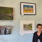 Art@Marinoto project co-ordinator Ruth Arnison stands with several works created by local artists...