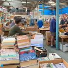Volunteer book sorters work towards the Regent Theatre 24 Hour Book Sale, coming up on February...
