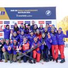 Wanaka biathlete Campbell Wright, (bib 34, front row) celebrates with the United States biathlon...