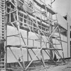 Rail-mounted scaffolding in use at the New Zealand and South Seas Exhibition construction site on...