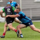 Bradley Cross tackling Eastern Northern Barbarians hooker Mykel Sleeman in his first game back in...