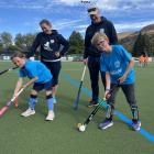 Hockey players Charlie Ferguson, 8, and Lucas Grant, 10, watched over by club vice-president...