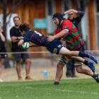 Arrowtown halfback Taine Wallace shrugs off Matakanui tackler Archie Calder to dot down for one...