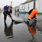Cleaning up in South Dunedin after last year's flooding. Photo: Stephen Jaquiery