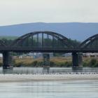 Gulls rest on a gravel bank extending across the Clutha River near the Balclutha Bridge yesterday...
