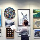 Aislinn Roodt, of Dunedin, admires some of the artworks on display at the Cleveland National Art...