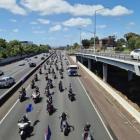 Make New Zealand Great Again protesters on State Highway 1, Auckland. Photo: Jessica Hopkins / RNZ