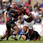 Highlanders winger Jona Nareki attacks the Crusaders defence during the preseason game in...