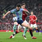 Declan Rice of Arsenal shields the ball from Victor Lindelof of Manchester United during their...