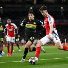 Kieran Tierney of Arsenal looks to cross the ball whilst under pressure from Richard Ledezma of...