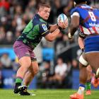 Highlanders prop Ethan de Groot, in the team’s one-off Hulk jersey, looks for options during the...