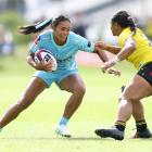 Winnie Palamo (left), of Matatū, attempts to evade Ayesha Leti-I’iga, of the Hurricanes Poua,...
