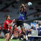 Mark Tele’a of the Blues fumbles a high ball in their big loss to the Crusaders on Saturday night...
