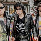 Seiji (centre) is bringing Guitar Wolf’s Jett Rock &amp; Roll tour to the "strange city" of...
