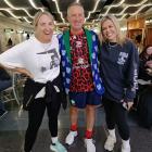 Up the Wahs! Warriors fan Tom Jones, of Tapanui, meets television presenters Brodie Kane (left)...