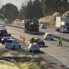 Police direct traffic at the Fairfield on-ramp following a crash yesterday morning. Photo: Craig...