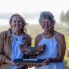 Surf Life Saving New Zealand life members Marilyn Moffatt (left) and Carol Quirke hold the Pat...