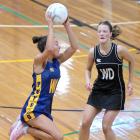 Physed A wing attack Gemma Rowcroft leaps high to claim a pass as Southern wing defence Emma De...