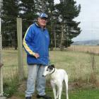 Otago Greyhounds president Murray Hill with his retired greyhound, Cheery Crusher. PHOTO: NIC DUFF
