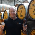 The New Zealand Whisky Collection head distiller Michael Byars proudly shows off his two award...