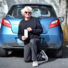 Dunedin man Denis Albert holds a $65 ticket from the Parking Enforcement Services he and his wife...