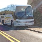 A Reach Coach charter bus parked on the side of Blackhead Rd, by the double yellow lines. Photo:...
