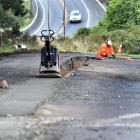 A contractor works in Reeves St, Roseneath, this week as part of an effort to improve resilience...