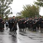 The host pipe band, the ILT City of Invercargill Highland Pipe Band, during the street march at...