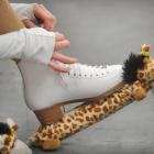Tying up the skates during time off the ice.