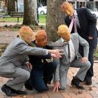 Taking to the streets of Dunedin yesterday are masked performers (from left) Blaise Barham,...