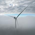 A turbine for the Kaiwera Downs wind farm, 11km east of Mataura, pokes through low cloud last...