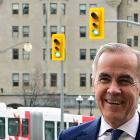 Canada's Prime Minister Mark Carney walks into his office after the Liberal Party staged a major...