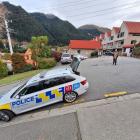Police in Turner St in Queenstown, where a tourist had a serious fall. PHOTO: GUY WILLIAMS